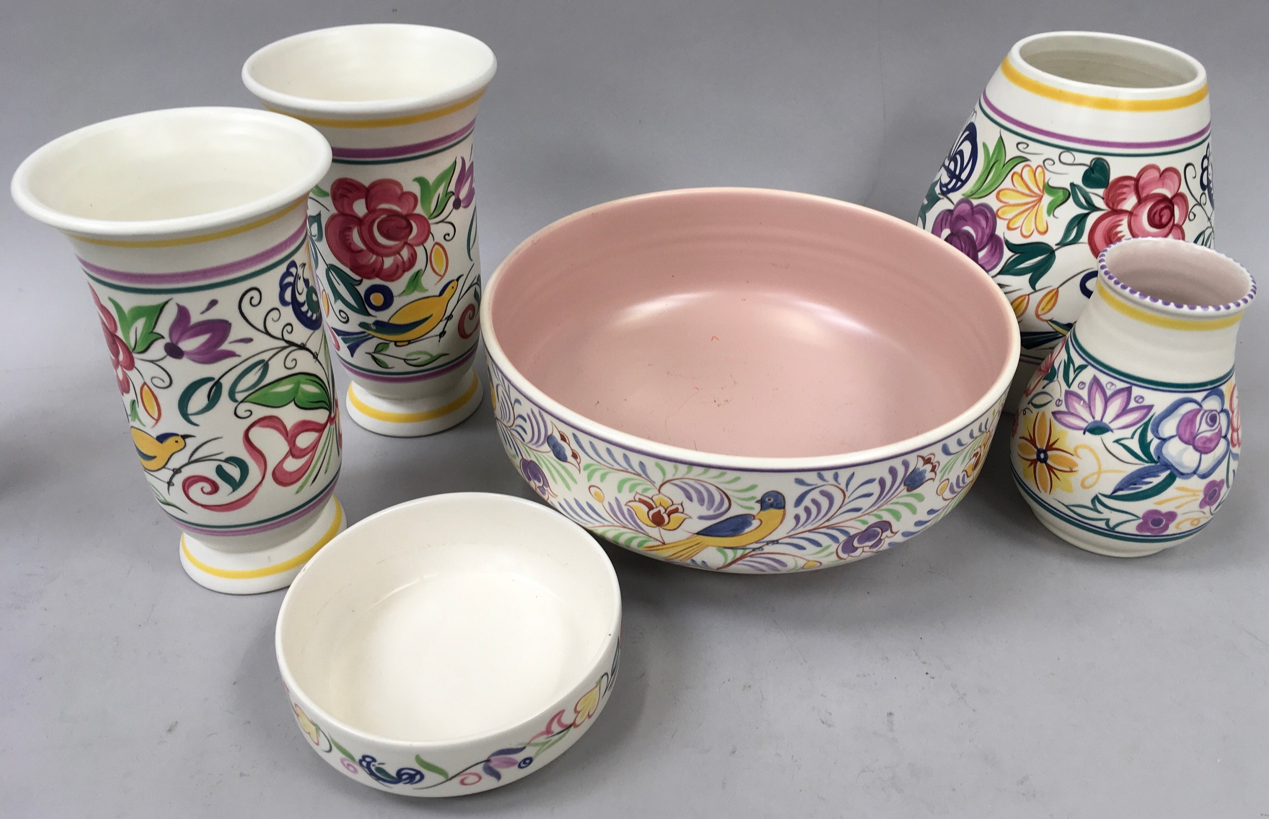 Quantity of traditional Poole pottery to include a large bowl decorated with birds