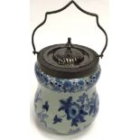 A ceramic Victorian style bulbous blue and white biscuit barrel.