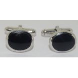 A pair of silver and onyx cufflinks cased.