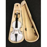 Contemporary modern violin with bow in case.