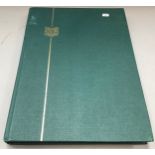 Green S.G. stockbook filled with commonwealth stamps.