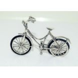 An unusual silver Schwinn style articulate ladies bicycle.