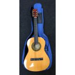 Herald MG104N acoustic guitar with carry bag.