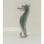 A silver and cultured CZ seahorse brooch.