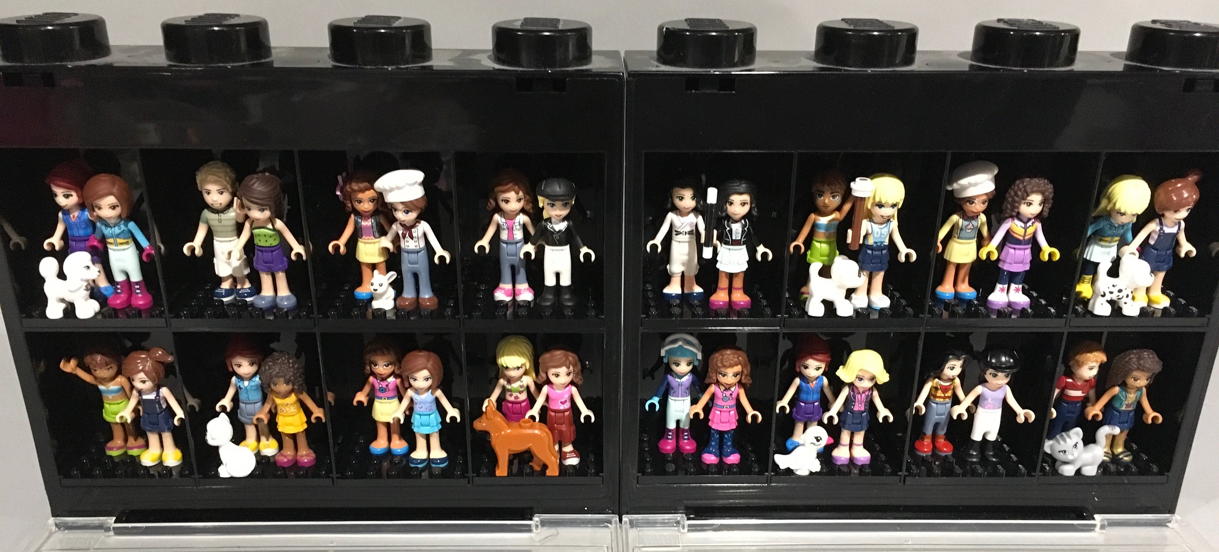 32 Lego Friends Minifigures with some animals and accessories in display cases. - Image 2 of 2