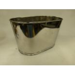 A large silver plated champagne bucket with inscription to side.