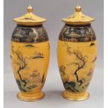 Pair of Carlton Ware lidded vases each 20cm tall.