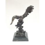 "Mene" spelter figure of an eagle on stepped marble base.