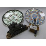 Oriental collectibles including two 12" chargers, a Soapstone posy holder and a figure of a scribe