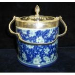 A blue and white china biscuit barrell