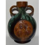 Antique twin handled vase in the style of Christopher Dresser for Linthorpe Pottery. 21cm tall.
