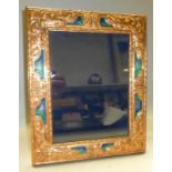 A copper and enamel easel backed picture frame.