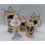 Four German beir steins and a continental china figure of a boy