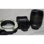Nikon DX AF-S Nikkor 18-105mm 1:3.5-5.6 zoom lens c/w a Sigma EM-140 DG ring flash with carry bag.