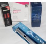 Various boxed cosmetics including hair growth treatments, a 3-in-1 face brush and a Sonic Chic