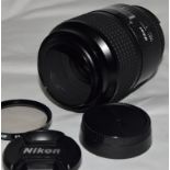 Nikon AF Micro Nikkor 105mm 1:2.8 D portrait lens c/w front and rear caps and 1a skylight filter.