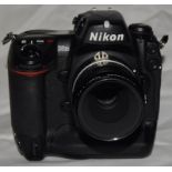 Nikon D2Xs digital SLR camera c/w Nikon Micro Nikkor 55mm 1:2.8 prime lens. Battery is included