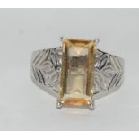 A designer 925 silver ring with large yellow stone to centre, size O (ref DR6)