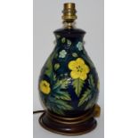 Moorcroft lamp base depicting yellow & blue flowers 27cms high (to top of light fitting)