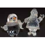 Swarovski Crystal Santa Christmas ornament code 221362 together with a Snowman code 250229 both