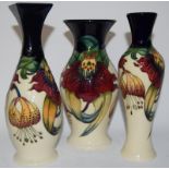 Moorcroft "Anna Lily" vase 21.5cms high, together with one other 19.5cms high and another 20cms
