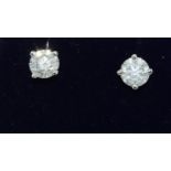 Pair of 18ct white gold stud earrings of approx 1.1ct