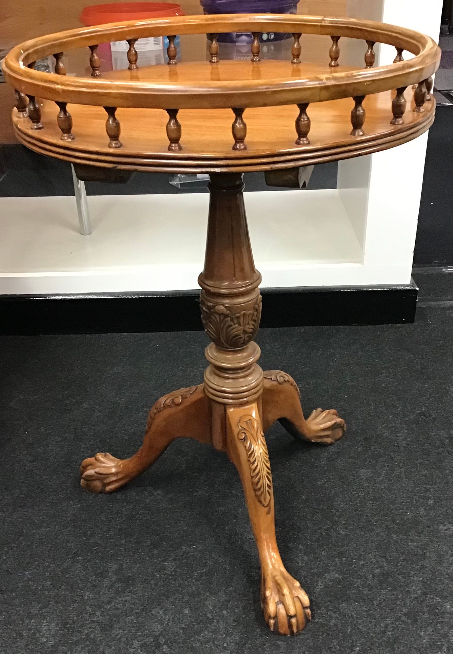 Round gallery tray top table on carved tripod support set with ball and claw feet 65x45cm