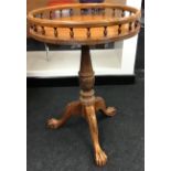 Round gallery tray top table on carved tripod support set with ball and claw feet 65x45cm
