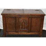 Arts and Crafts small oak coffer with brass hinged lid and carved decoration to front. 85cm across x