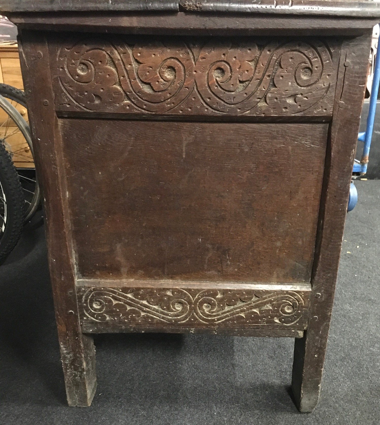 Good elm coffer with carved panels and original metal fitments solid plank top missing part of - Image 4 of 8