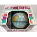 12" world globe boxed.