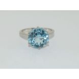 Silver ladies blue stone solitaire ring. Size S.