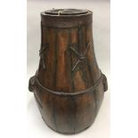 Chinese hard wood brass bound barrel/rice carrier of baluster form with metal strap work