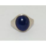 A gents silver ring with blue stone and English hallmark. Size R