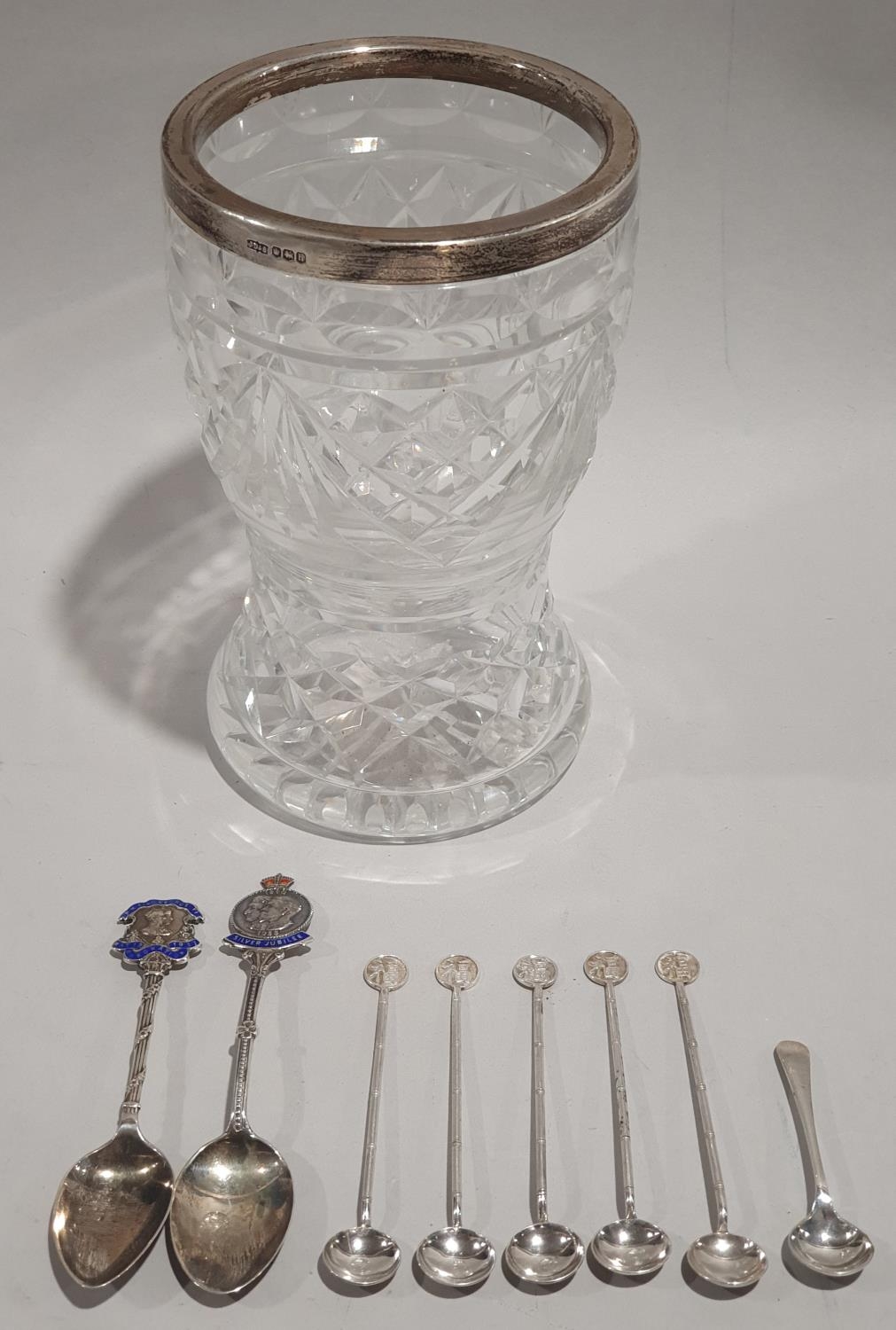 Collection of eight small silver spoons together with a silver rimmed crystal glass vase.