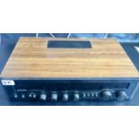 ROTEL RX-402 RECEIVER AMPLIFIER. Vintage stereo receiver amplifier with woodgrain case. Made in