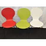Three modern brightly coloured plywood and chrome stacking chairs