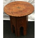 Moorish round topped table with folding base 42cm tall 36cm diameter.