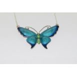 A silver enamel butterfly necklace.