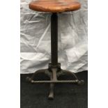 Cast iron adjustable bar stool with wooden seat 60cm tall.