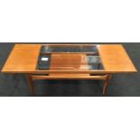 G Plan "Fresco" coffee table with middle inset glass panel to top. Has G Plan label 137x51x42cm.