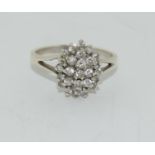 A heavy 925 silver cluster ring, Size T