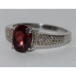 A silver 925 ring with garnet stone size Q