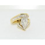 Impressive 18ct yellow gold ring the central pear shape diamond of approx 1.5ct with channel set