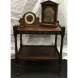 Mahogany butler's trolley on castors 63x45x73cm together with two vintage clocks.