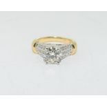 14ct mix colour gold ring the central diamond approx 1.6ct flanked by diamond shoulders size