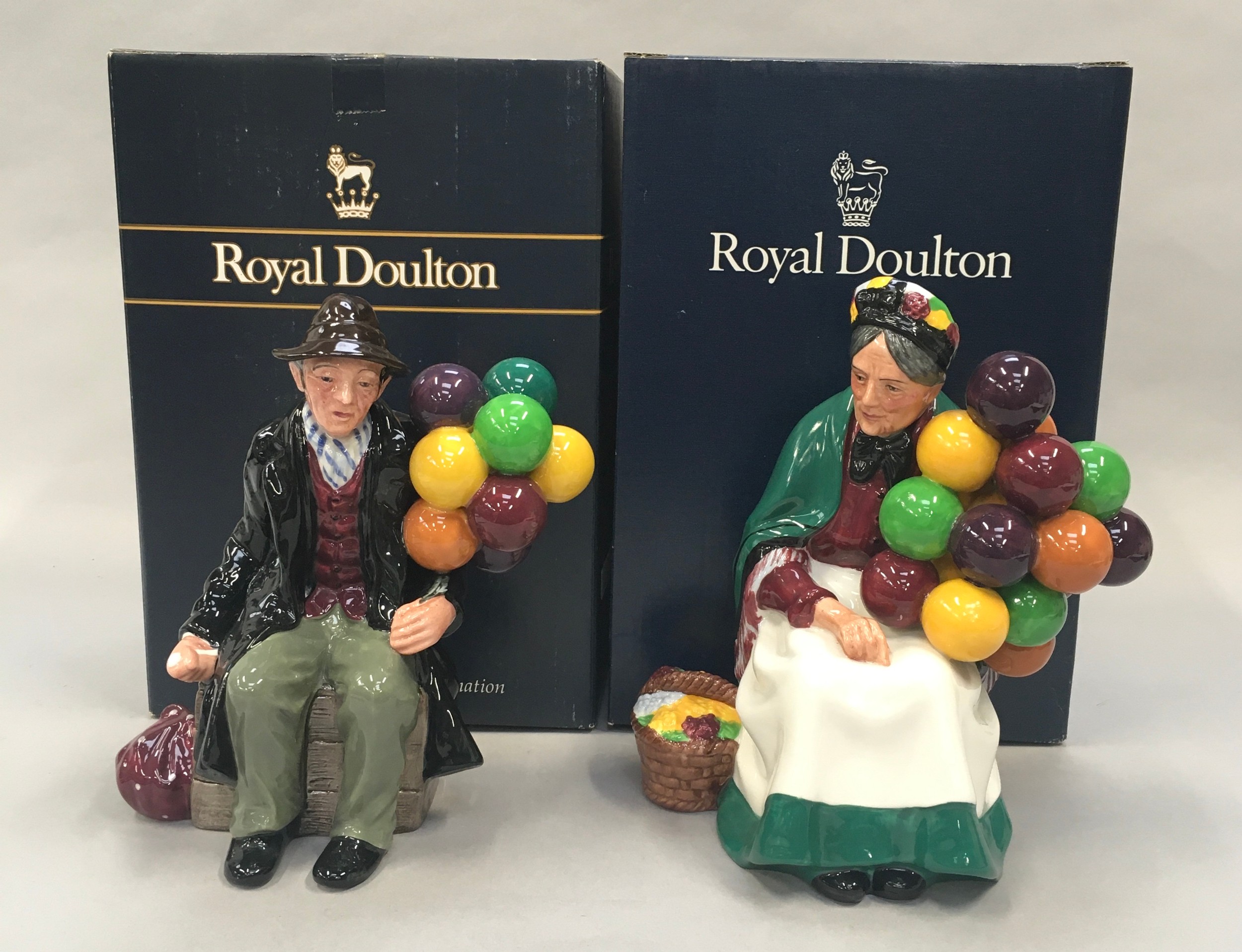 Royal Doulton Figurine The Old Balloon seller HN1315 together with The Balloon Man HN1954, Boxed