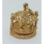 9ct gold charm of a fair ground carousel with revolving center