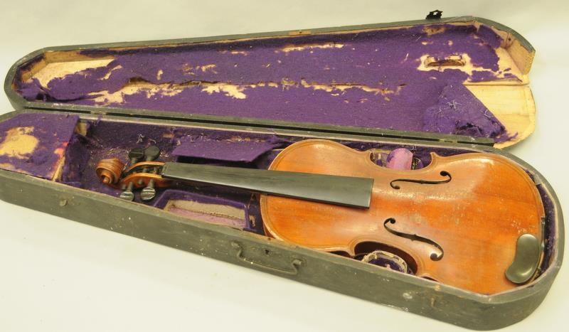 Antique violin. Label inside body reads 'Maggini Dentiche Arbeit'. Comes in original wooden coffin