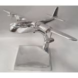 Polished aluminum model of a Sutherland Flying boat on stand.